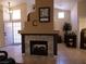 Inviting living room with a stone fireplace and a view of the front entrance at 9705 Templemore Ave # 102, Las Vegas, NV 89129