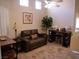 Cozy living room with tile floors, a ceiling fan, and a comfortable sofa at 9705 Templemore Ave # 102, Las Vegas, NV 89129