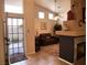 Bright living room with a fireplace and views to backyard and dining room at 9705 Templemore Ave # 102, Las Vegas, NV 89129