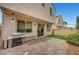 Outdoor area with brick patio, barbecue grill, string lights, and sliding glass door to the home's interior at , Las Vegas, NV 89139
