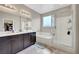 Bright bathroom with double sink vanity, separate tub and shower, and neutral paint at , Las Vegas, NV 89139
