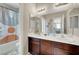 Bathroom featuring double sink vanity with bath/shower combo with decorative curtain at , Las Vegas, NV 89139
