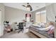 This cozy bedroom is carpeted and includes a ceiling fan and built in desk area at , Las Vegas, NV 89139