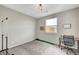 Empty bedroom with window, desk and chair, and neutral paint at , Las Vegas, NV 89139