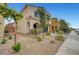 Street view of a two-story home with desert landscaping, a covered entry, and a two-car garage at , Las Vegas, NV 89139