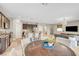 Open concept kitchen and living room with stainless steel appliances, eat in island, and stylish decor at , Las Vegas, NV 89139