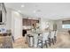Kitchen features granite countertops, large island with seating, stainless steel appliances, and dark wood cabinets at , Las Vegas, NV 89139