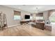 Bright living room featuring hardwood floors, modern lighting, and a large sectional sofa at , Las Vegas, NV 89139