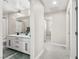 Hallway bathroom featuring double sinks and tile flooring and ample cabinet space at 10101 Heron Lake Ave, Las Vegas, NV 89178