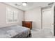Bedroom with bed, dresser, and doorway to bathroom at 10101 Heron Lake Ave, Las Vegas, NV 89178