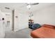 This bedroom features carpet, neutral walls, a ceiling fan, a bed, a closet and a window at 10101 Heron Lake Ave, Las Vegas, NV 89178