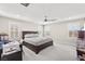Cozy bedroom with plantation shutters, ceiling fan, and a comfortable bed at 10101 Heron Lake Ave, Las Vegas, NV 89178