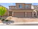 Charming two-story home features a two-car garage and well-manicured front yard at 10101 Heron Lake Ave, Las Vegas, NV 89178