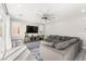 Bright living room featuring a ceiling fan, recessed lighting, and a large sectional sofa at 10101 Heron Lake Ave, Las Vegas, NV 89178