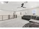 Spacious loft with a sectional sofa, a beanbag chair, and plantation shutters at 10101 Heron Lake Ave, Las Vegas, NV 89178