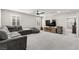 Loft with a comfortable sectional sofa, large television, and natural light at 10101 Heron Lake Ave, Las Vegas, NV 89178
