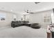 Upstairs living room with multiple windows, sofa, and ceiling fan at 10101 Heron Lake Ave, Las Vegas, NV 89178