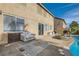 This spacious backyard boasts a swimming pool, outdoor seating, patio, and a grill at 104 Glendive St, Henderson, NV 89012