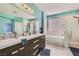 Luxurious bathroom with double sinks, separate tub and shower, and modern fixtures at 104 Glendive St, Henderson, NV 89012