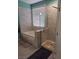 Bathroom with a tub and glass shower in a modern tile setting at 104 Glendive St, Henderson, NV 89012