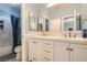 Bathroom featuring double sinks, lots of mirror space, and modern fixtures at 104 Glendive St, Henderson, NV 89012