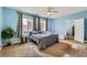 Spacious primary bedroom with a ceiling fan, plush carpet, and ensuite access at 104 Glendive St, Henderson, NV 89012