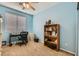 Bright bedroom with a ceiling fan, a desk, and a bookshelf at 104 Glendive St, Henderson, NV 89012