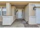 Covered front porch entry featuring updated lighting, and a neutral color palette at 104 Glendive St, Henderson, NV 89012