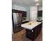 Spacious kitchen featuring a center island and stainless steel refrigerator at 104 Glendive St, Henderson, NV 89012