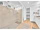 Modern bathroom featuring glass enclosed shower and double sinks with walk-in closet at 10601 Skye Arroyo Ave, Las Vegas, NV 89166