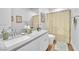Bright bathroom with a shower curtain, vanity, and stylish decor at 10601 Skye Arroyo Ave, Las Vegas, NV 89166