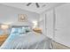 Inviting bedroom with a queen bed, soft lighting, and neutral decor at 10601 Skye Arroyo Ave, Las Vegas, NV 89166