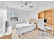 Bright bedroom with a TV, large window, and stylish decor, perfect for relaxing or working at 10601 Skye Arroyo Ave, Las Vegas, NV 89166