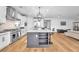 Modern kitchen with stainless appliances, large island, and seamless access to the living area at 10601 Skye Arroyo Ave, Las Vegas, NV 89166