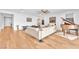 Inviting living room with hardwood floors, white sofas, and grand piano at 10601 Skye Arroyo Ave, Las Vegas, NV 89166