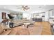 Spacious open floor plan with modern kitchen, hardwood flooring, and comfortable living area at 10601 Skye Arroyo Ave, Las Vegas, NV 89166