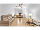 A cozy living room space, with hardwood floors and minimalist decor at 10601 Skye Arroyo Ave, Las Vegas, NV 89166