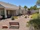 This backyard is landscaped and has a covered patio at 10816 Elm Ridge Ave, Las Vegas, NV 89144