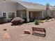 Spacious backyard featuring patio, desert landscaping, and inviting bench at 10816 Elm Ridge Ave, Las Vegas, NV 89144
