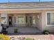 This covered backyard patio has nice landscaping at 10816 Elm Ridge Ave, Las Vegas, NV 89144