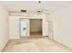 Spacious bedroom features neutral walls, ceiling fan, and an attached bathroom at 10816 Elm Ridge Ave, Las Vegas, NV 89144