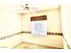 Bedroom featuring neutral carpet, ceiling fan, window with blinds, and decorative wall accents at 10816 Elm Ridge Ave, Las Vegas, NV 89144