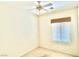 Bedroom featuring carpet, ceiling fan, and a large window at 10816 Elm Ridge Ave, Las Vegas, NV 89144