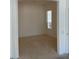 This bedroom offers a neutral space with natural light from a window at 10816 Elm Ridge Ave, Las Vegas, NV 89144