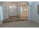 Bright and open foyer with stylish tile flooring and decorative pendant lighting at 10816 Elm Ridge Ave, Las Vegas, NV 89144