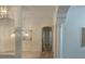 Bright hallway featuring stylish pendant lights and architectural columns at 10816 Elm Ridge Ave, Las Vegas, NV 89144