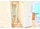 Hallway featuring beautiful tile flooring connecting different areas of the home at 10816 Elm Ridge Ave, Las Vegas, NV 89144