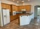 Well-appointed kitchen with ample cabinets, granite countertops, and modern appliances at 10816 Elm Ridge Ave, Las Vegas, NV 89144