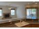 Open kitchen with granite countertops overlooking the living space and fireplace at 10816 Elm Ridge Ave, Las Vegas, NV 89144