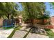 The backyard showcases lush landscaping and a trampoline, complemented by a paved patio area at 11004 Napa Ridge Dr, Las Vegas, NV 89144